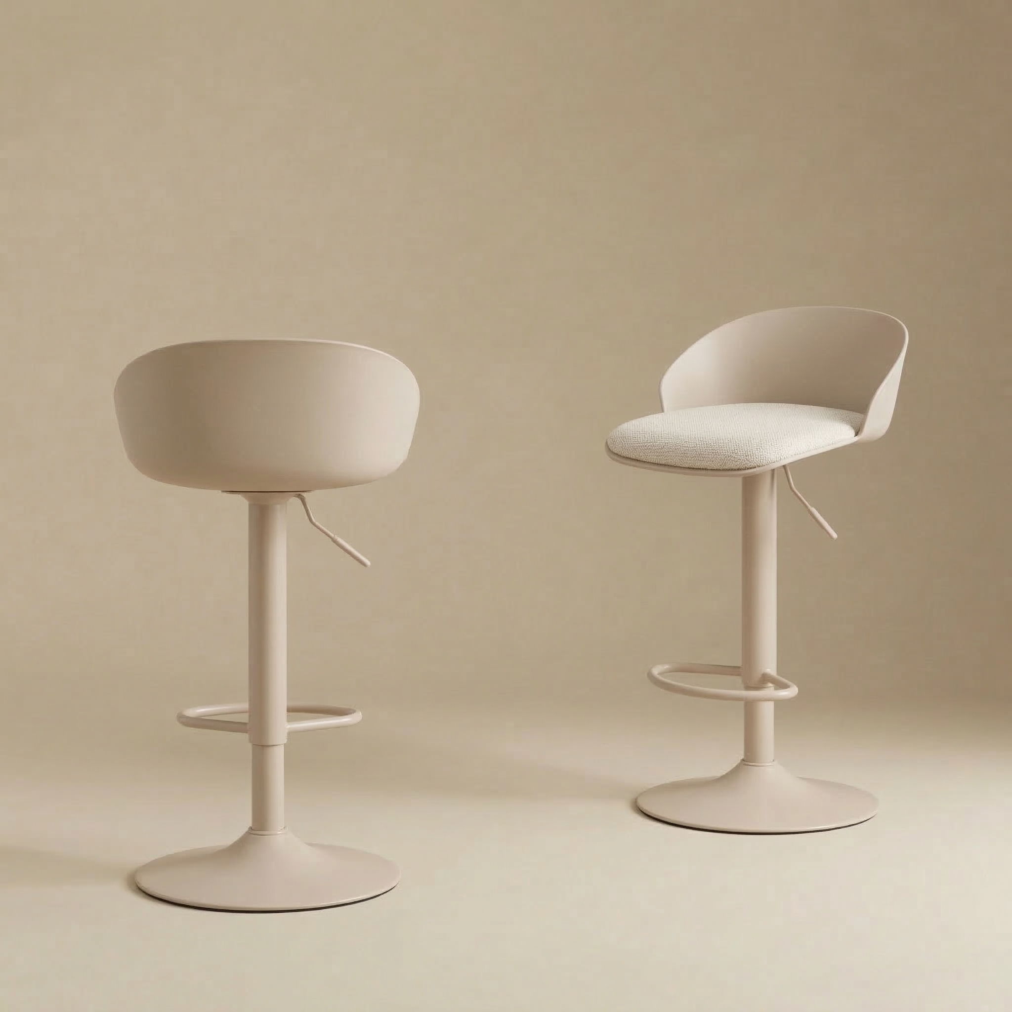 Two beige Orla adjustable swivel stools with upholstered seats, styled together on a neutral background to show different heights.