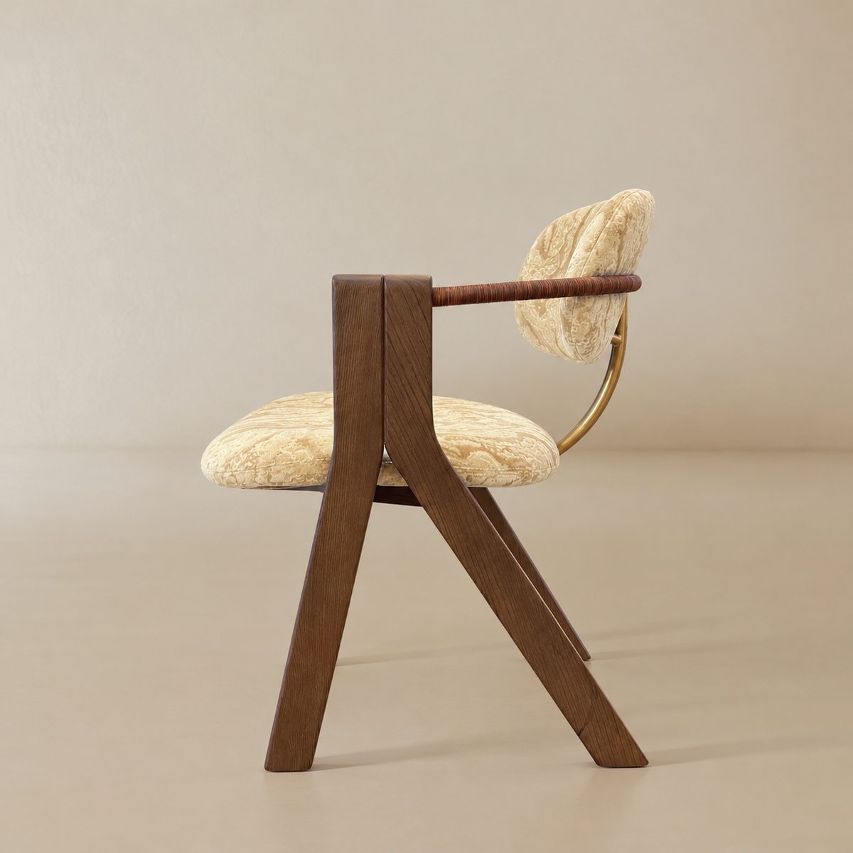 Side profile showing the angled wood frame, upholstered seat and backrest, wrapped armrest, and curved brass-toned back support.