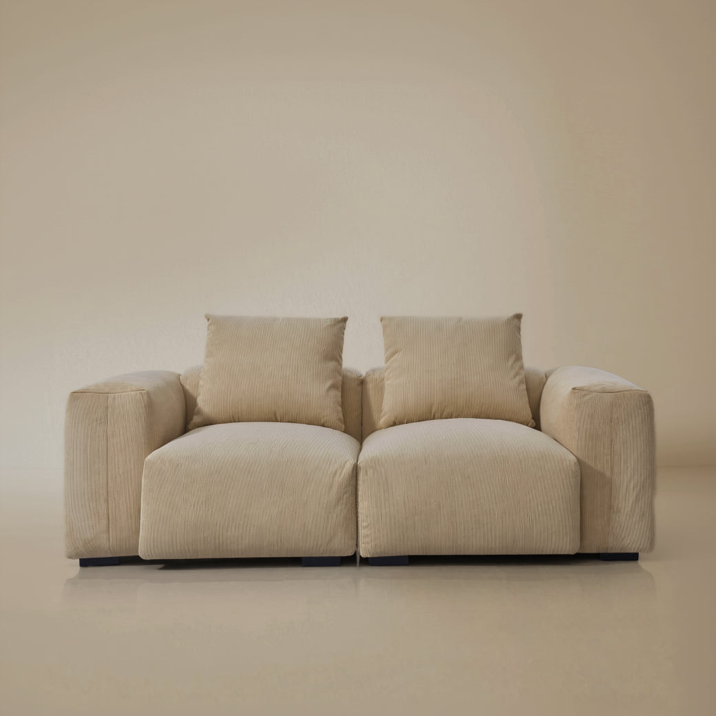 Front view of the two seater plush corduroy modular sofa in a studio background