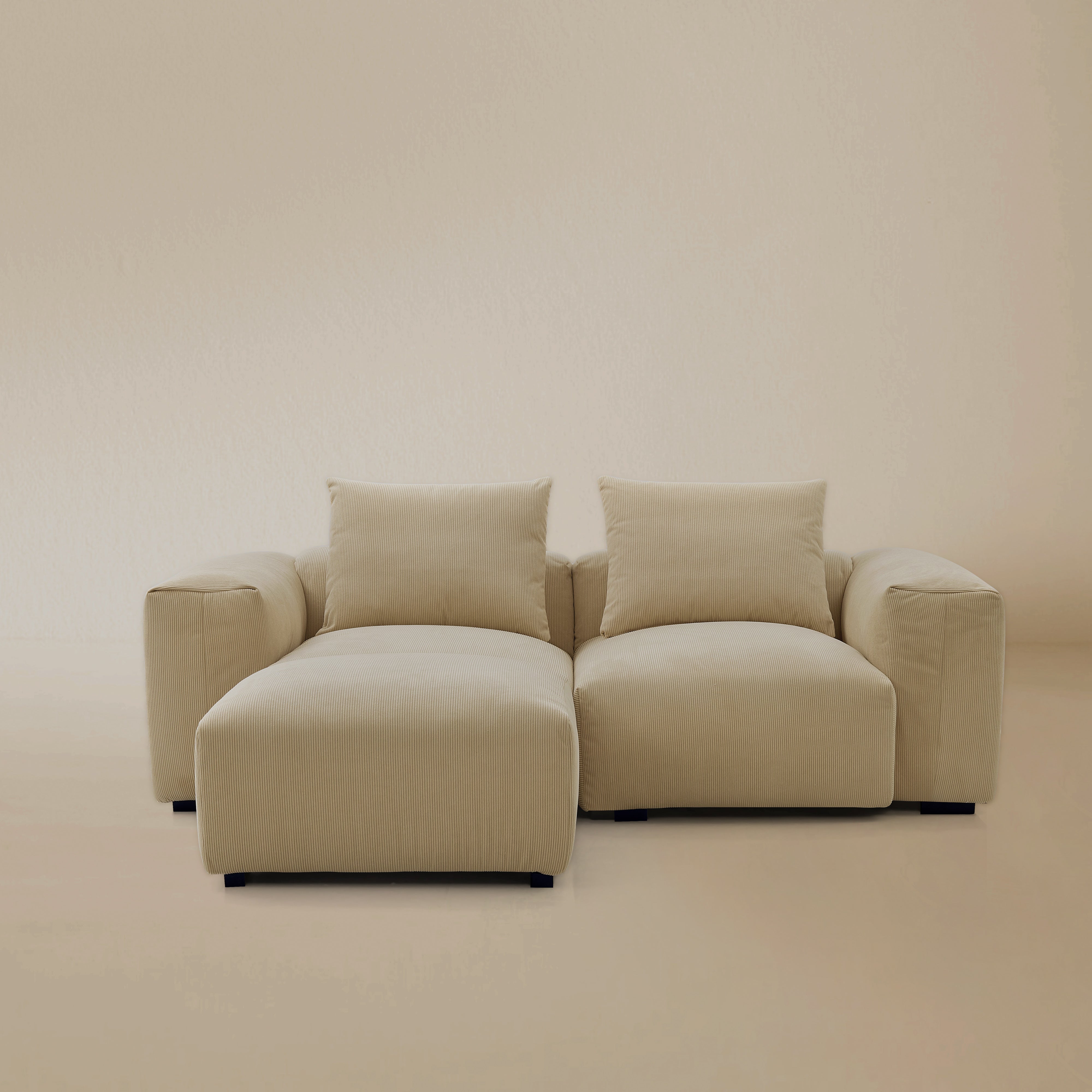 Two seater with ottoman plush corduroy modular sofa in a studio background