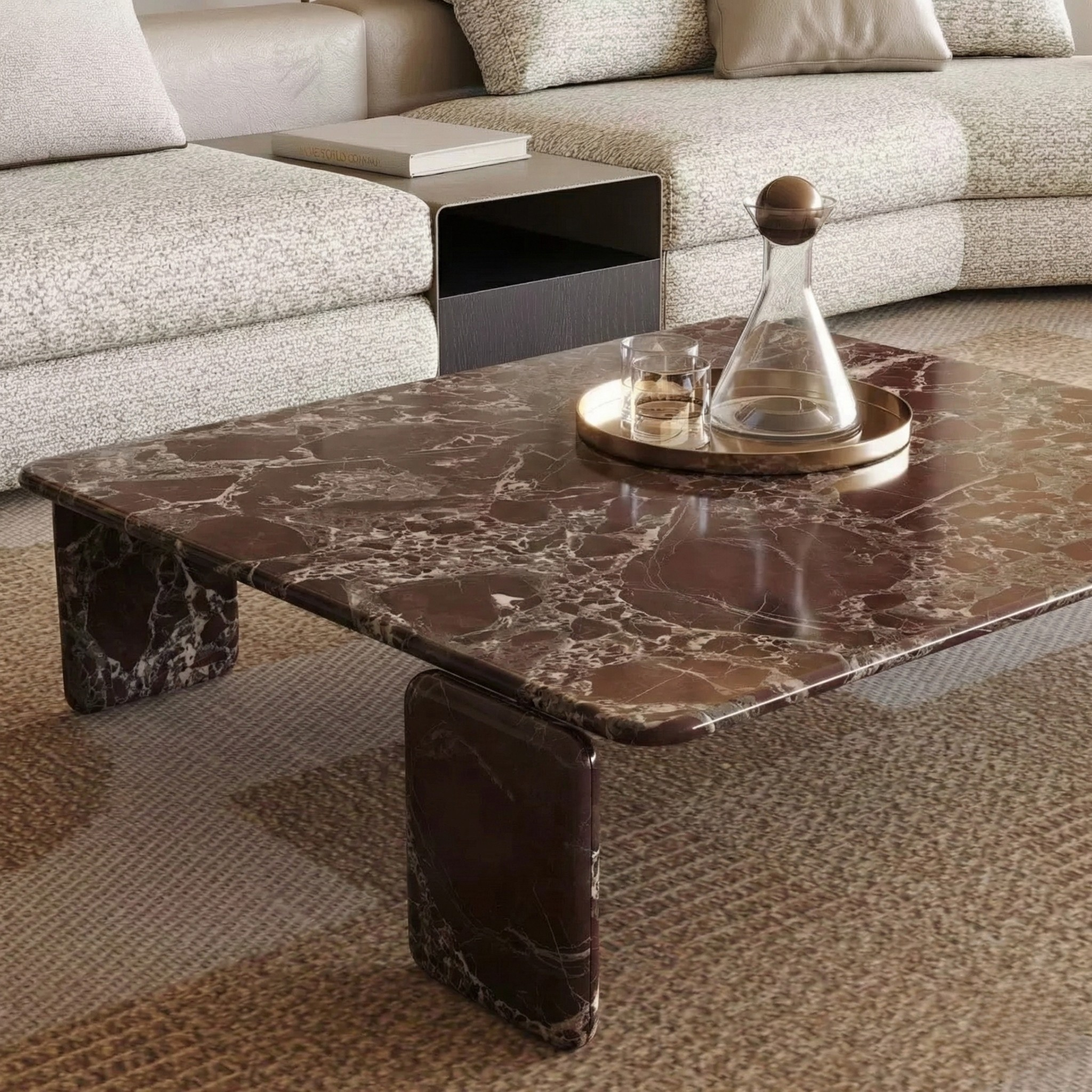 High-angle close-up of the Rosso Forma coffee table surface highlighting the rich burgundy stone and white natural veining.