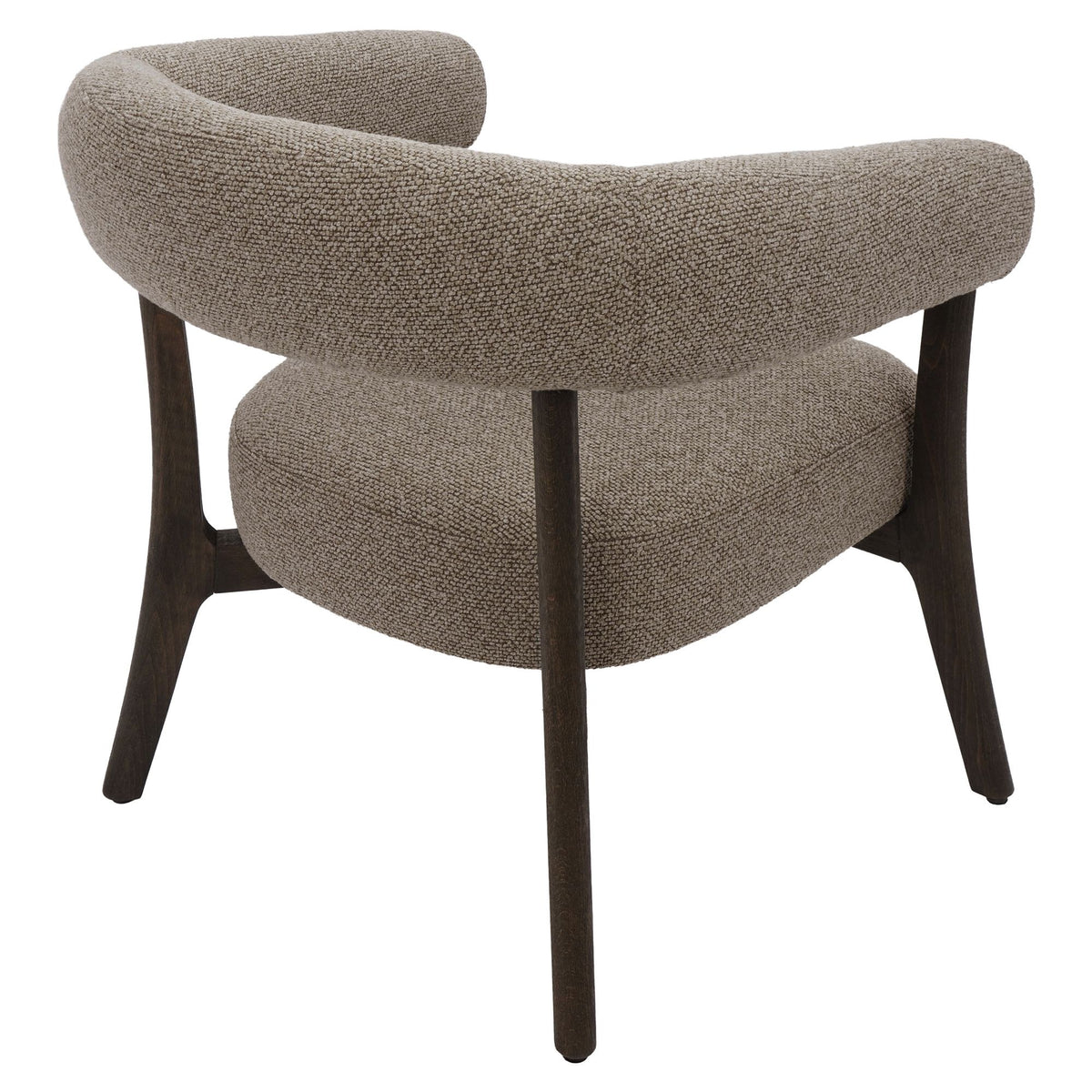 Three-quarter studio view of the Rowan chair in brown, highlighting the sculptural wrap-around backrest and tapering wood legs.