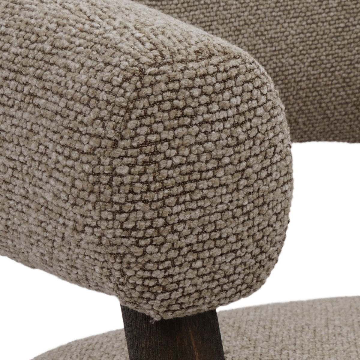 Macro close-up of the Rowan chair's brown fabric, showcasing the high-quality multi-tonal weave and rich tactile texture.
