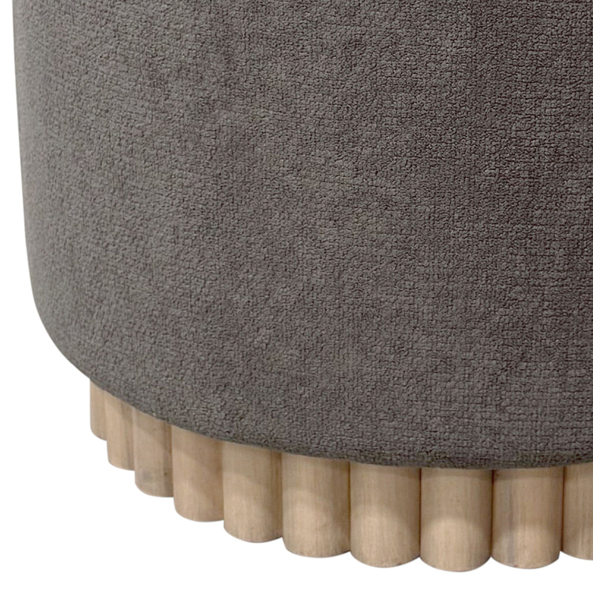 Close-up of a charcoal textured ottoman with wooden legs on a white background