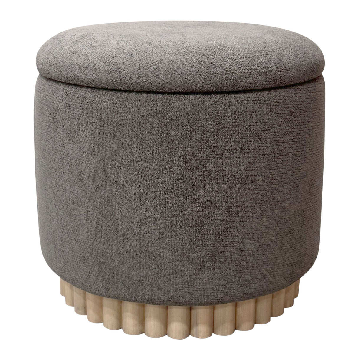 Gray round ottoman with a textured surface and wooden legs on a white background