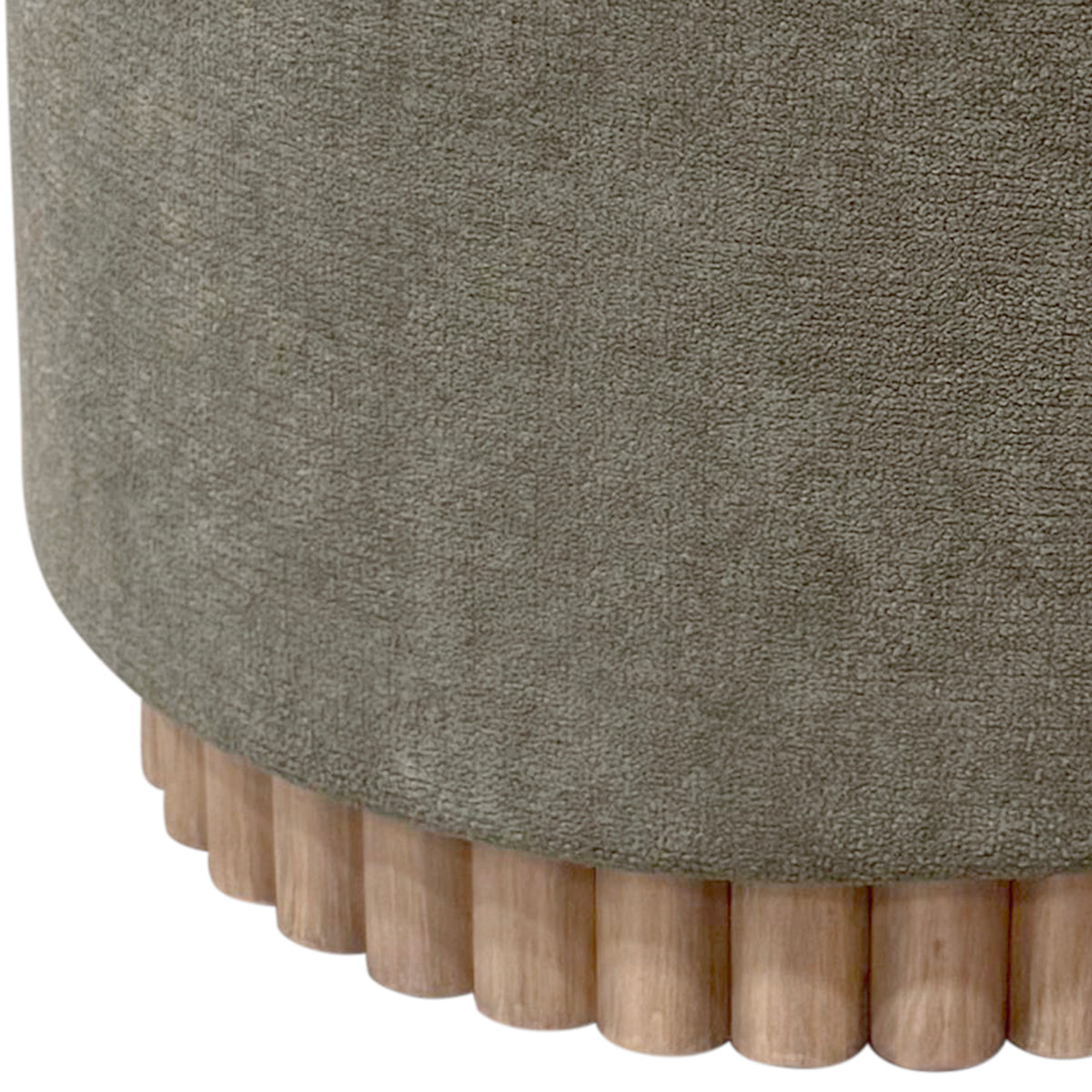 Close-up of a textured moss color ottoman with wooden legs on a white background