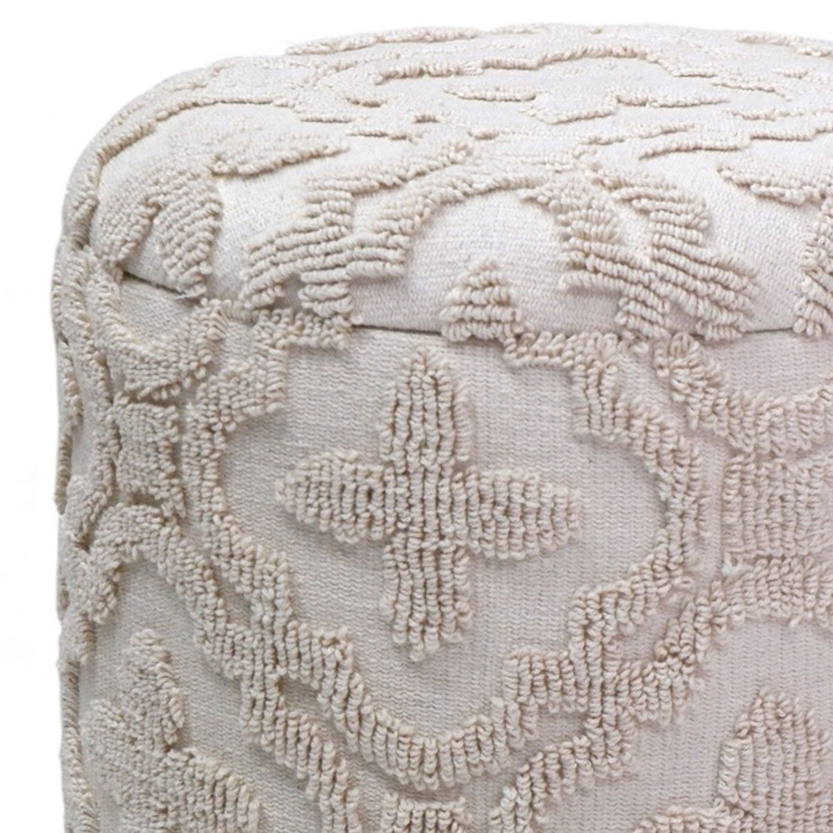 Textured beige ottoman with intricate pattern on a white background