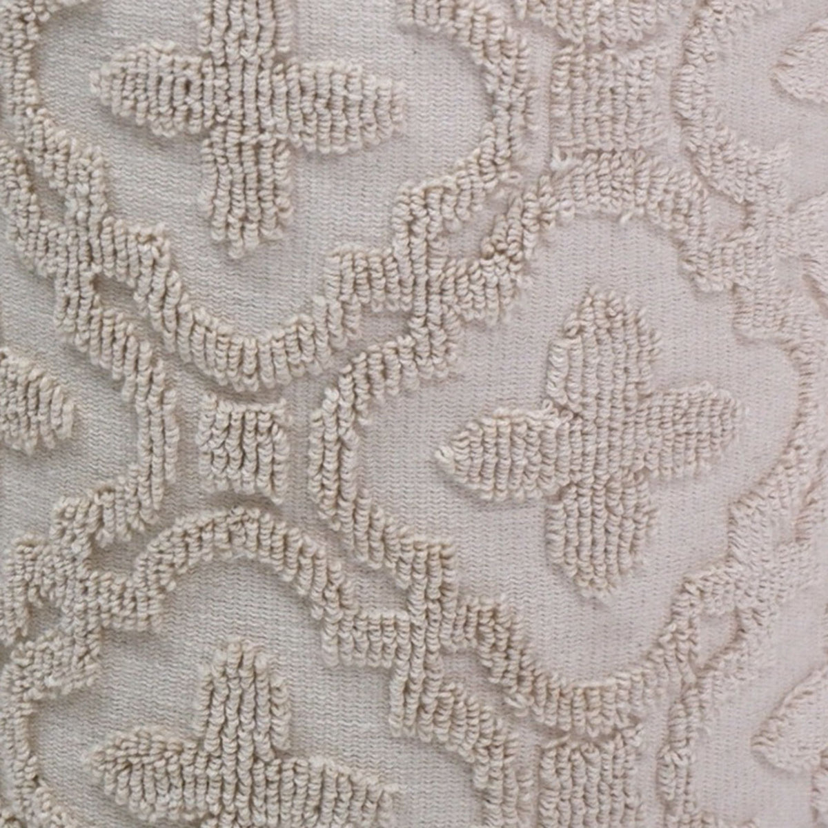 Close-up of beige floral lace fabric texture