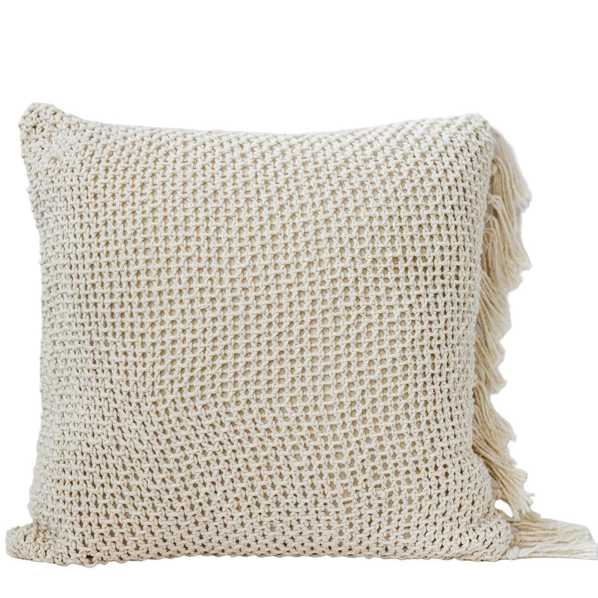 Beige woven pillow with tassels on a light gray background