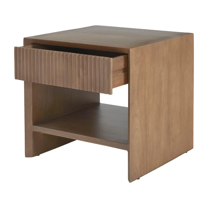 Angled view of the Silva mango wood nightstand with the fluted drawer partially open to show internal storage space.