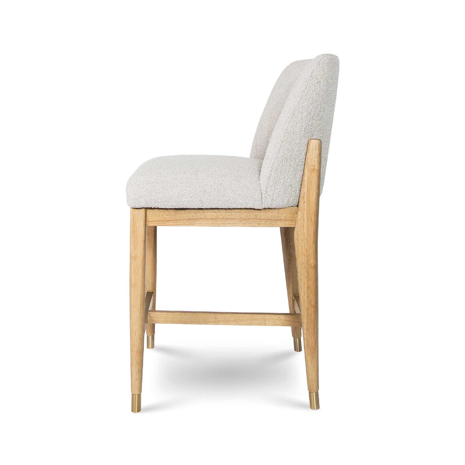 Direct side profile of the Sterling counter stool against a white background, highlighting its ergonomic curve and balanced proportions.
