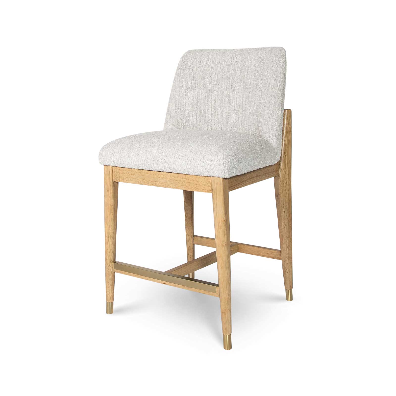 Angled studio view of the Sterling counter stool highlighting the elegant joinery where the wood frame meets the upholstered back.