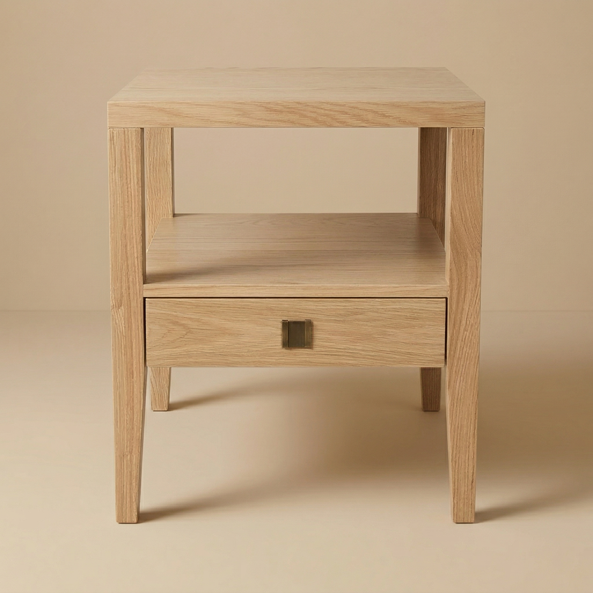 Full front view of the Sutton oak nightstand featuring an open cubby and a single storage drawer.