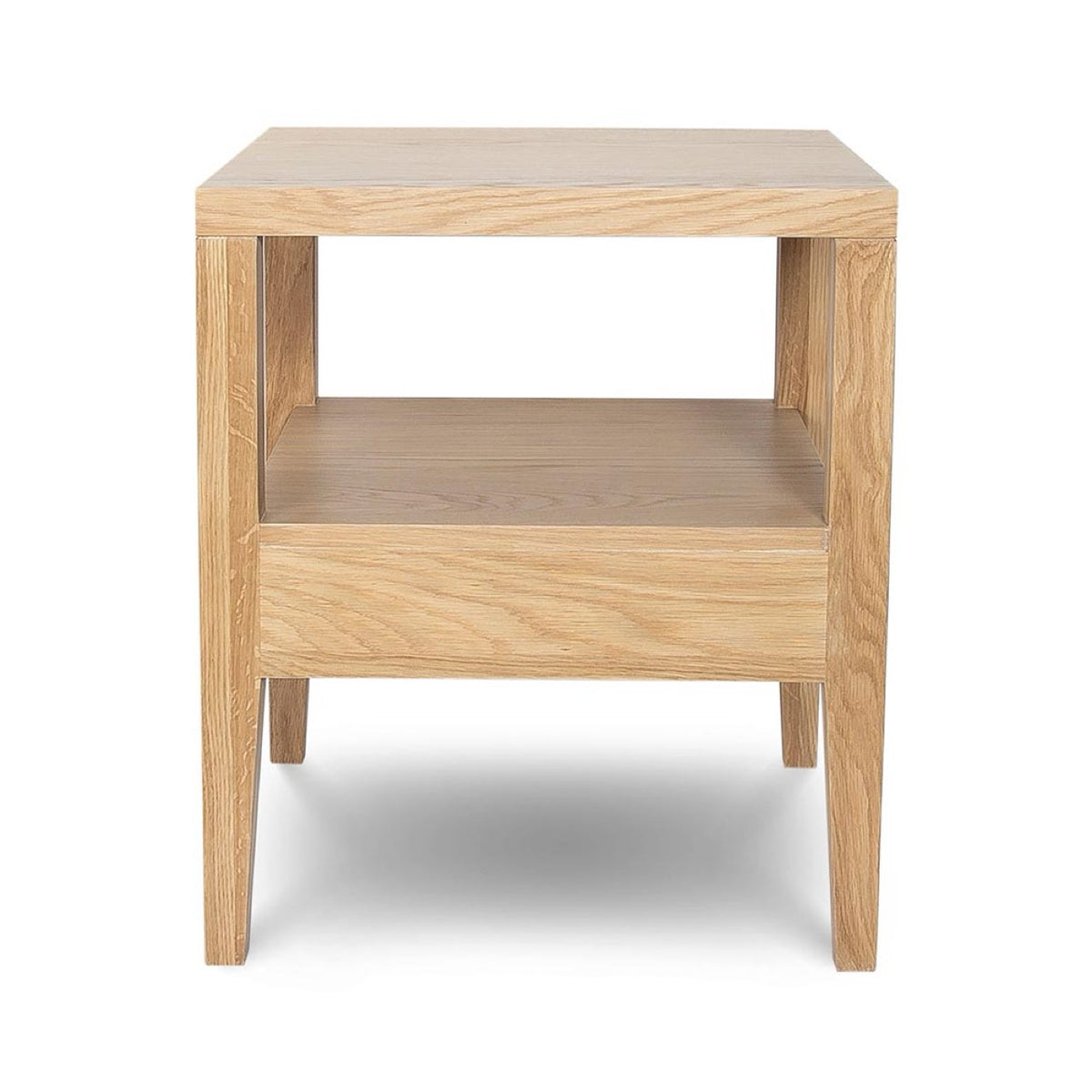 Rear studio view of the Sutton oak nightstand against a white background, showing the open-back cubby design.