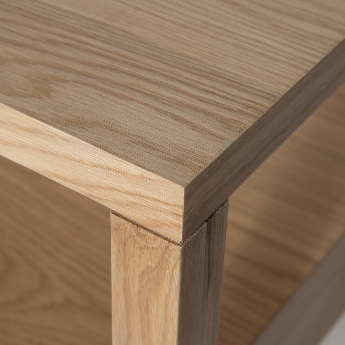 Macro close-up showcasing the high-quality wood grain and precise corner joinery of the Sutton nightstand.