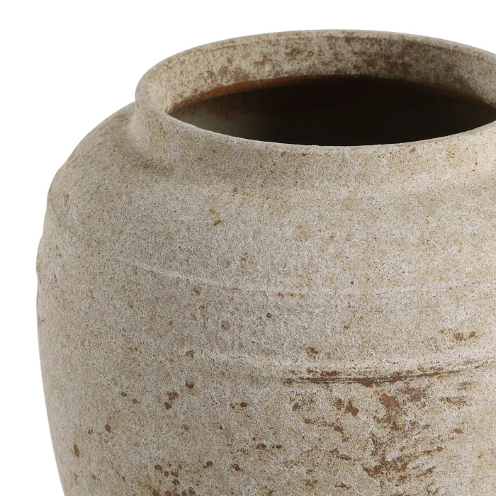 Close-up of a textured ceramic pot on a white background