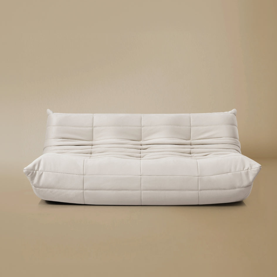 Front view of the TOGO Three Seater Lounger in a light beige studio background