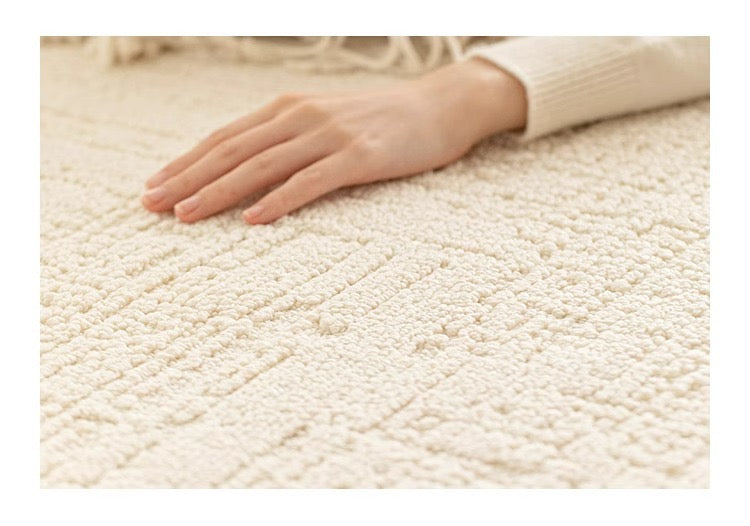 Close-up of the Tranquil Ivory Carpet showing the soft raised pattern under hand