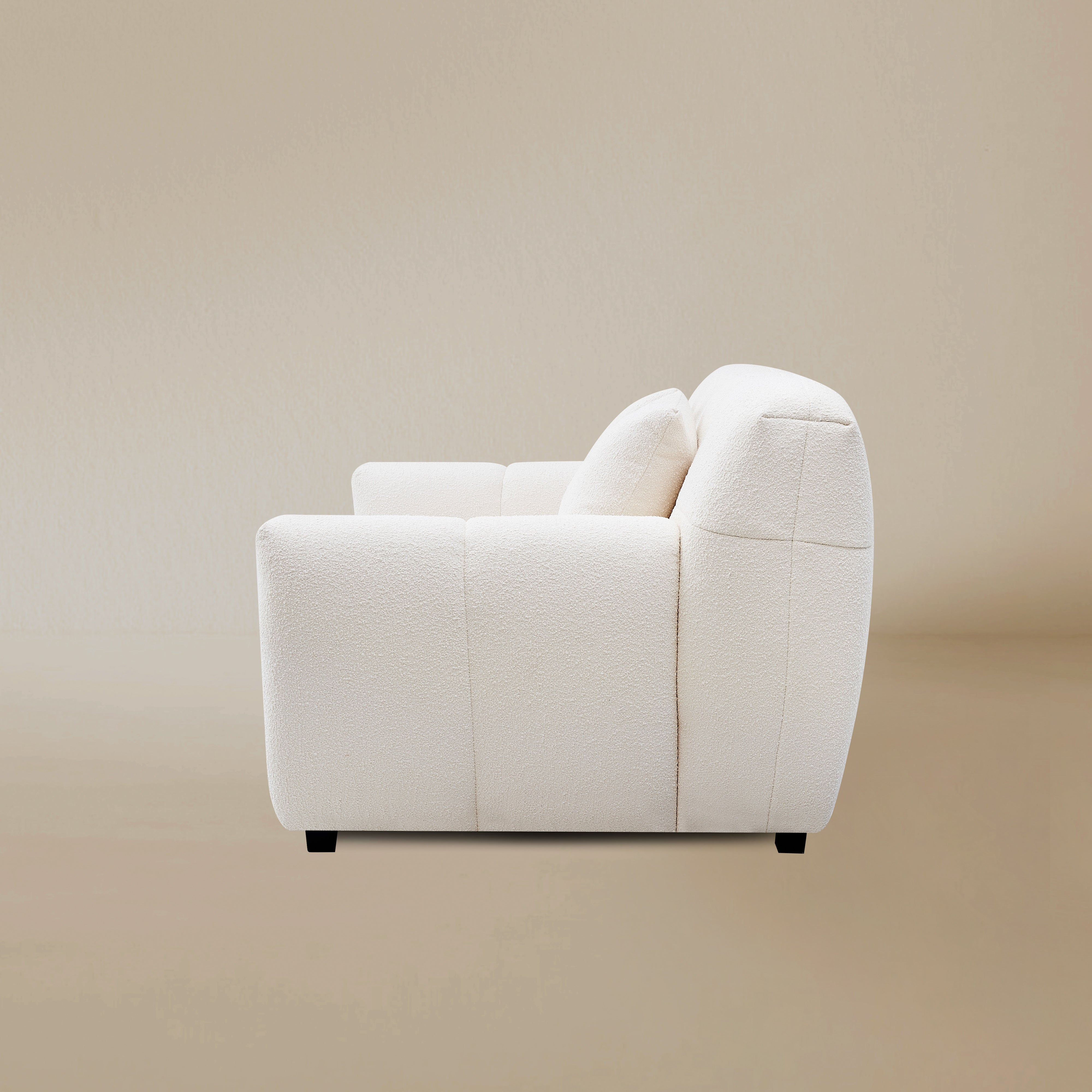 Side view of the Gummy loveseat variant, highlighting the plush vertical segments and low-profile silhouette.