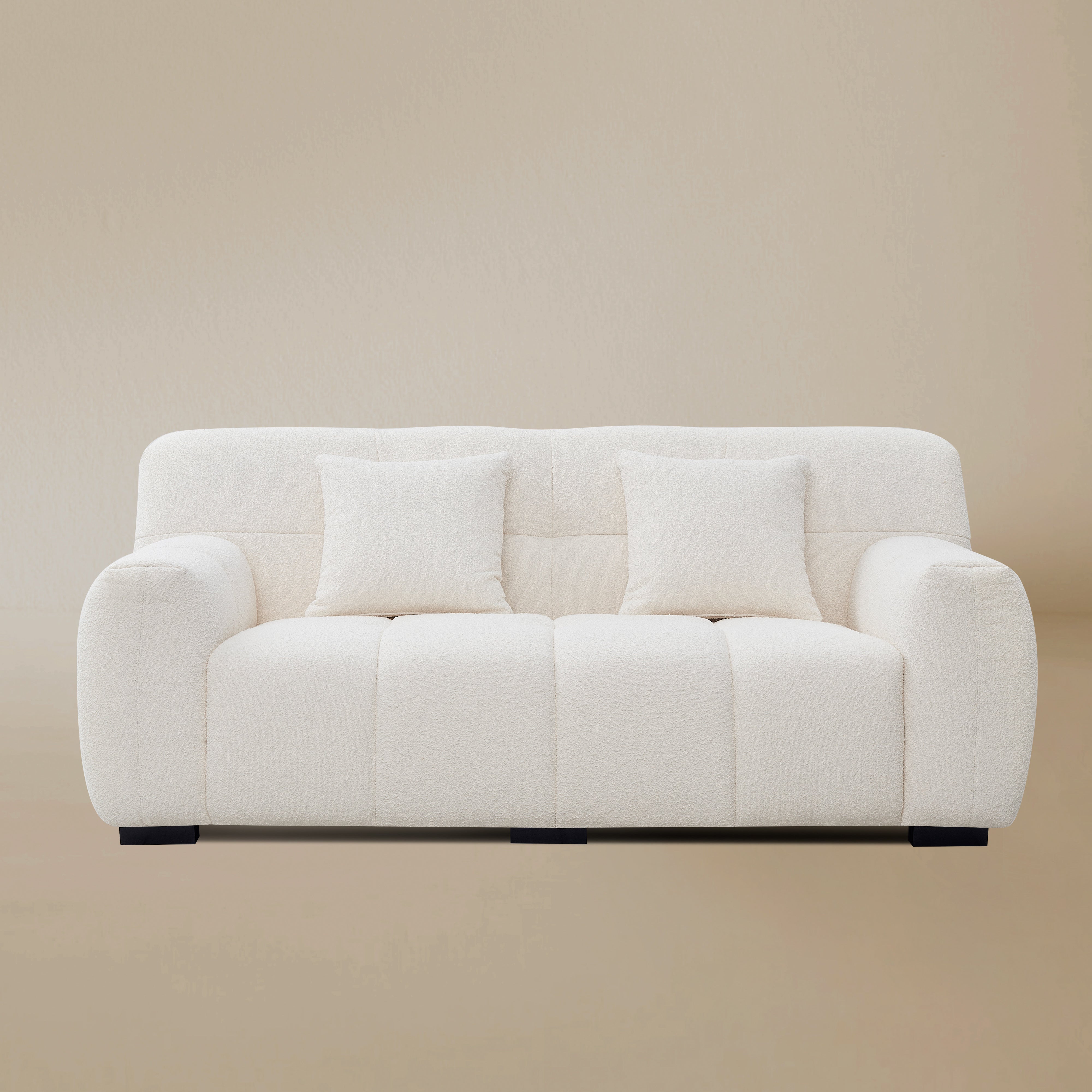 Front view of the Gummy loveseat variant, highlighting the plush vertical segments and low-profile silhouette.