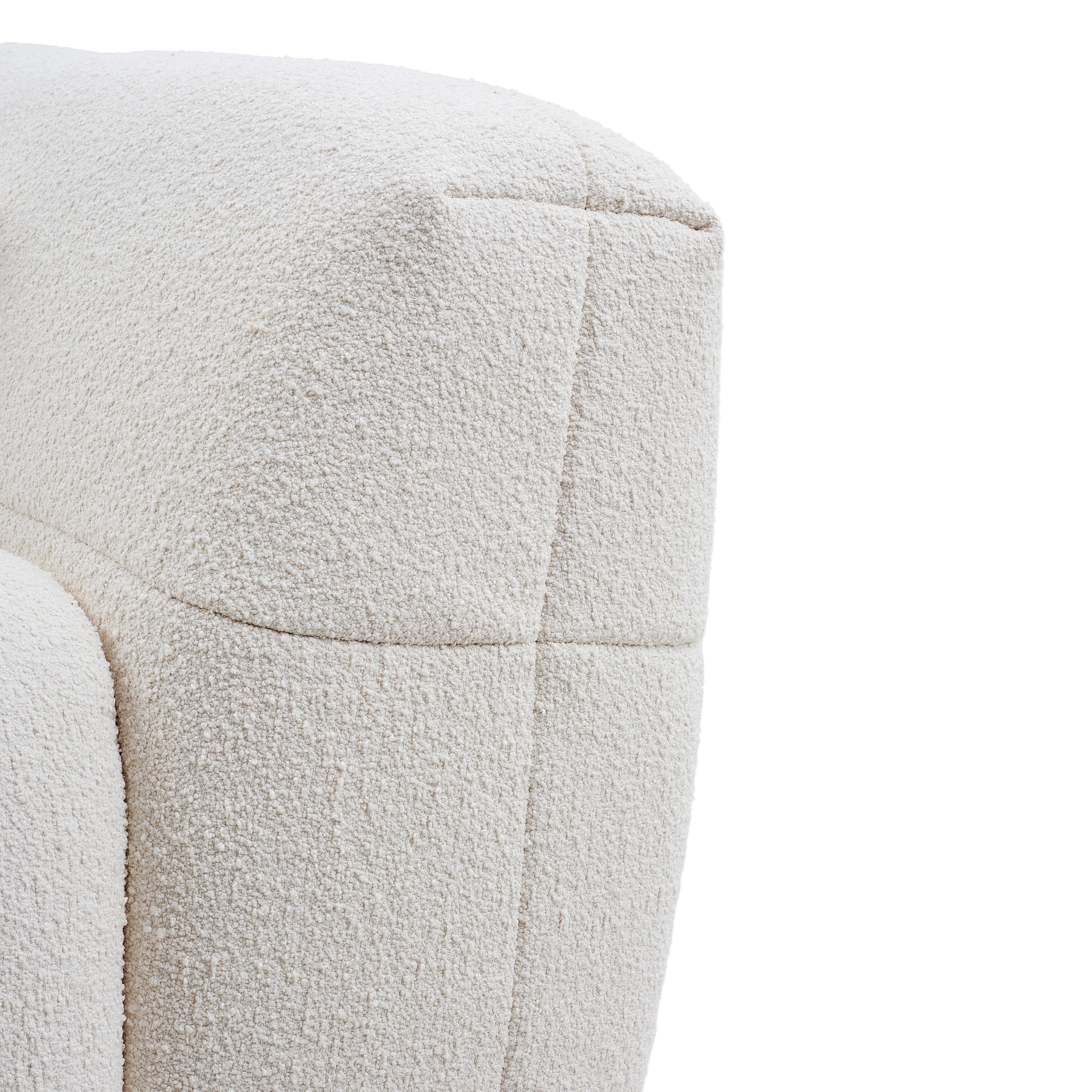 Close-up of the boucle fabric of the cream Gummy Sofa on a white background