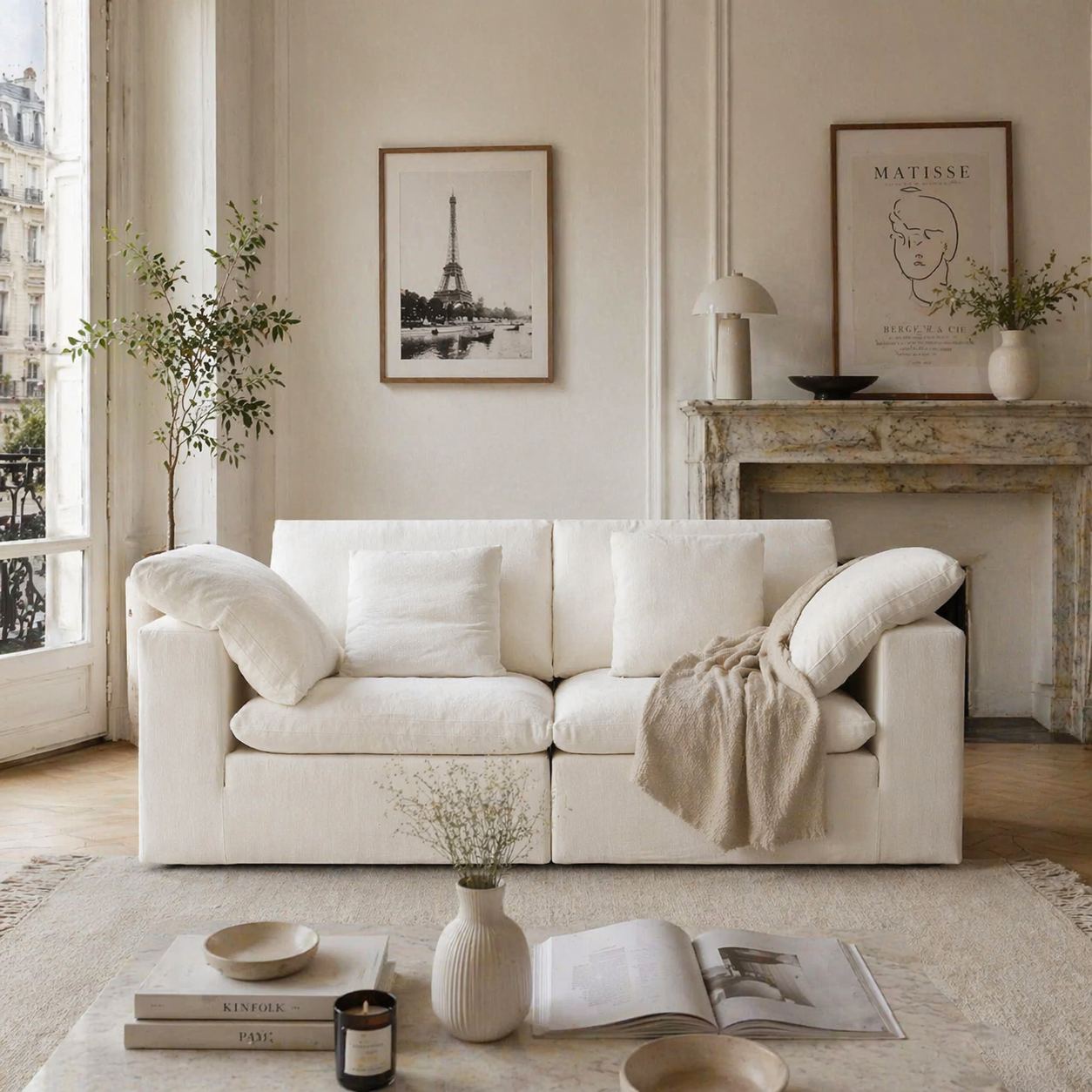 Ultra softness modular cloud sofa in a living room with Parisian style and decorative elements.