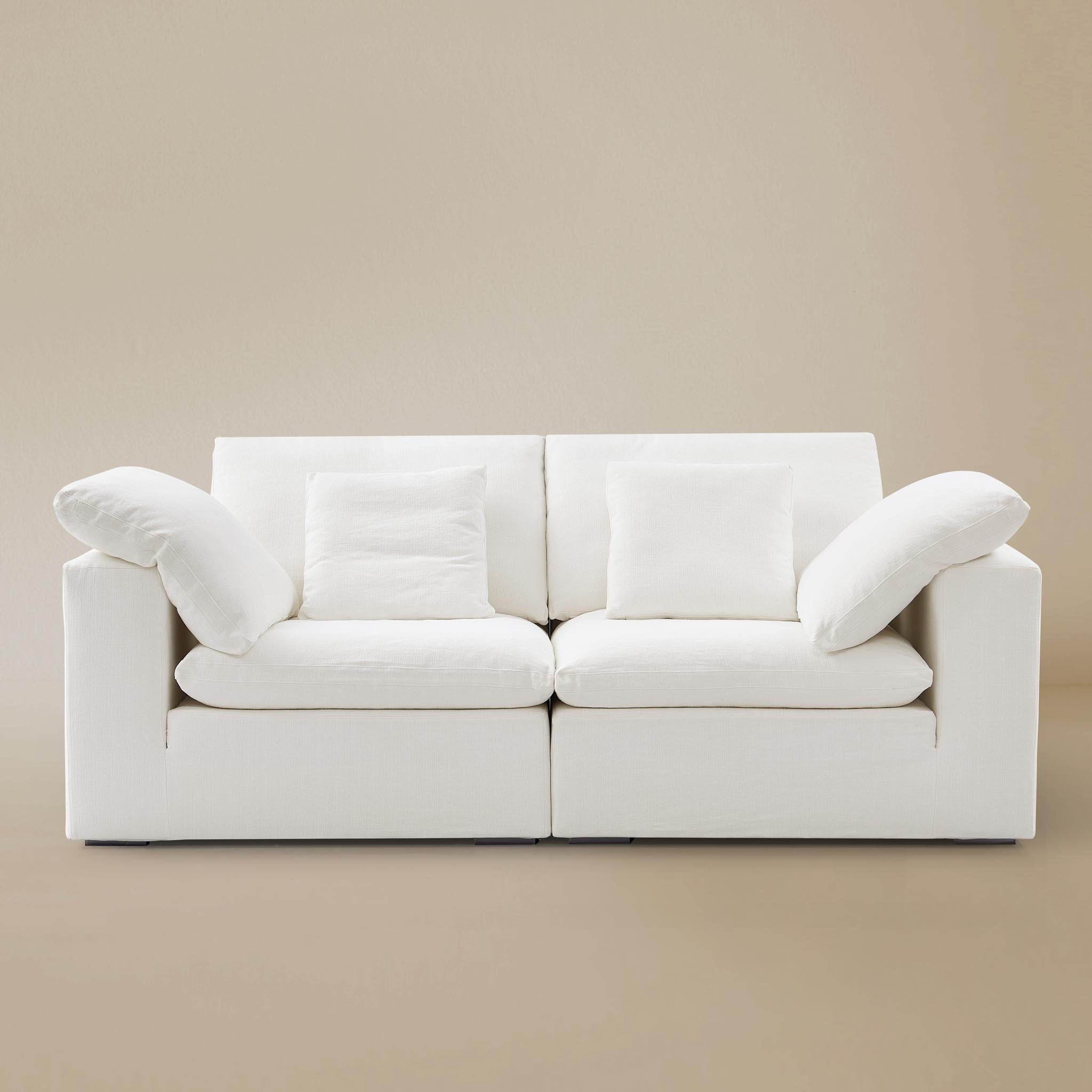 Front view of the Ultra Softness Cloud Sofa two-seater variant in natural linen on a clean studio background.