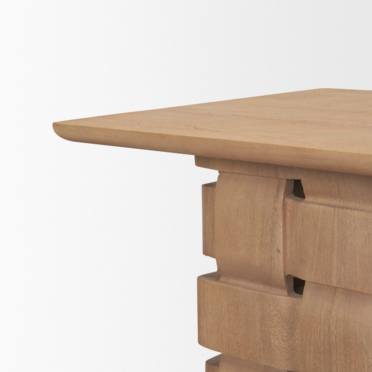 Close-up of the Varelle Side Table pedestal base showing the interlocking carved mango wood woven texture.