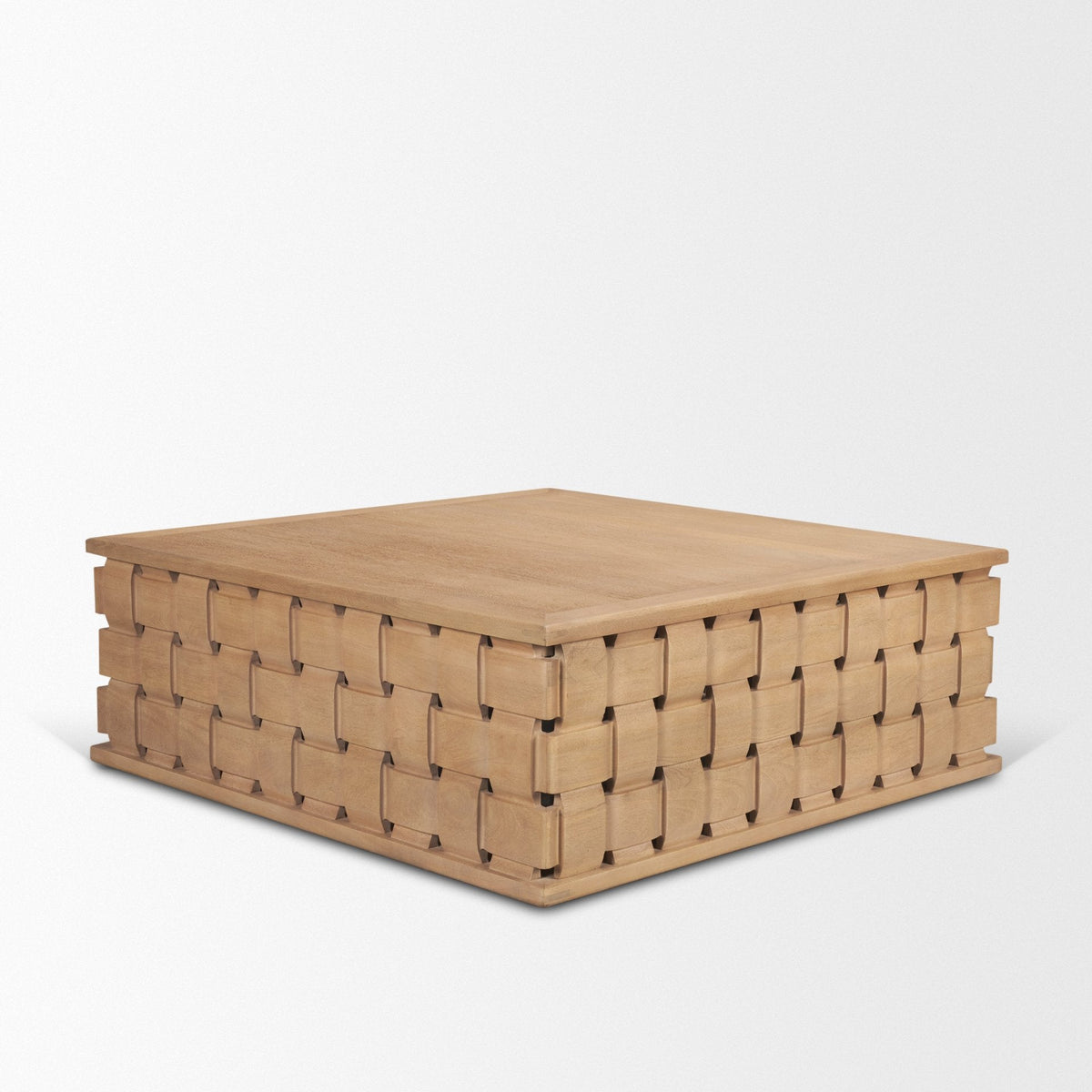 Angled view of the Varelle Carved Mango Wood Square Coffee Table showing the woven carved texture wrapping continuously around the block base.