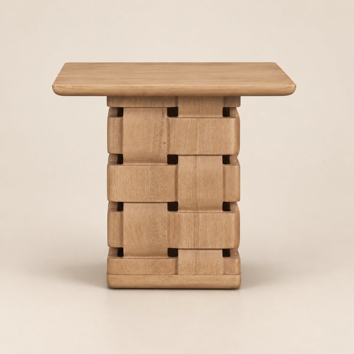 Front studio view of the Varelle Carved Mango Wood Square Side Table with a light brown mango wood top and carved woven pedestal base on a warm beige background.