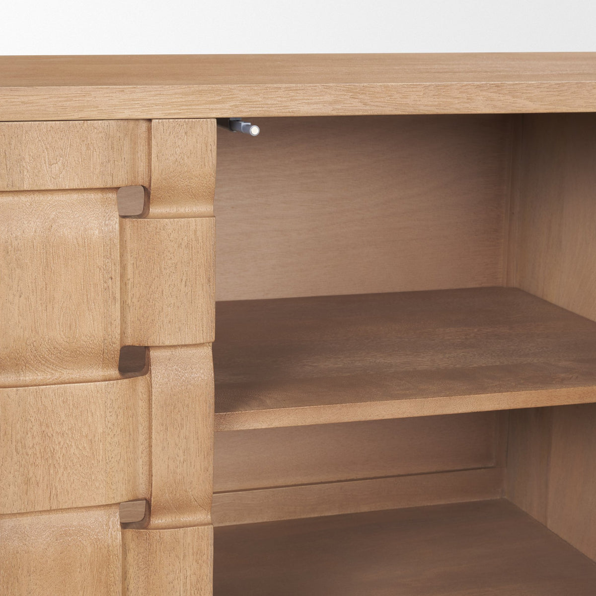Interior detail of the Varelle Sideboard showing the wood cabinet compartment and removable shelf storage.