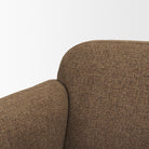 Close up detail of the curved backrest and woven mocha fabric texture on the Rowan chair.