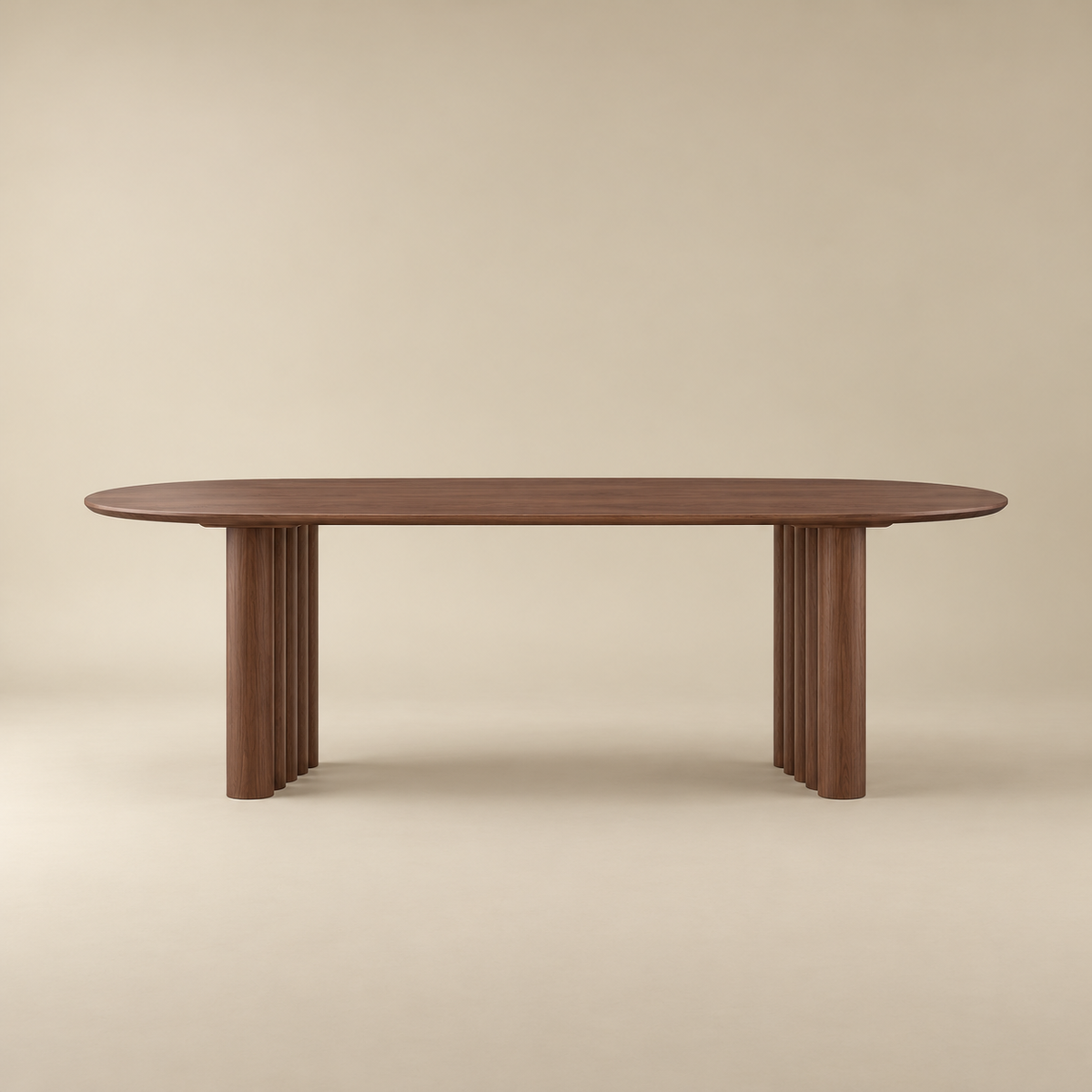 Adrian dining table with fluted pedestal legs, shown against a solid beige background.