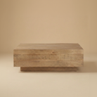 Front view of the Aero wood coffee table highlighting the horizontal plank design and recessed plinth base.