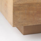 Detail shot of the bottom corner showing the recessed plinth base that gives the Aero table a floating appearance.