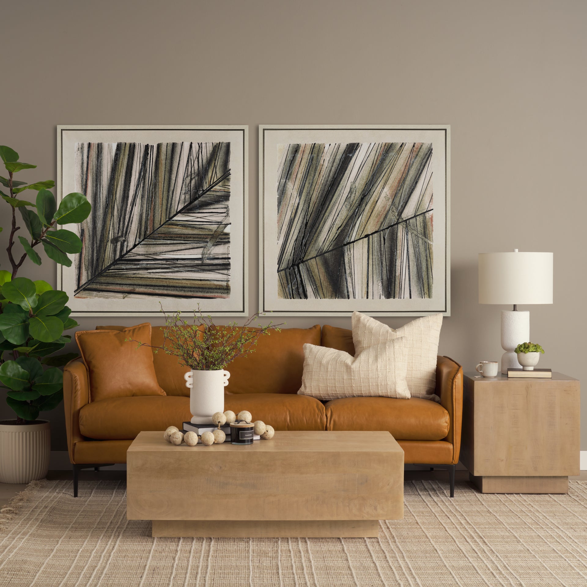 Modern living room with brown sofa, abstract art, and decorative items.