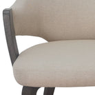 Close-up of a beige upholstered chair with a textured fabric finish featuring the Alden Dining Chair