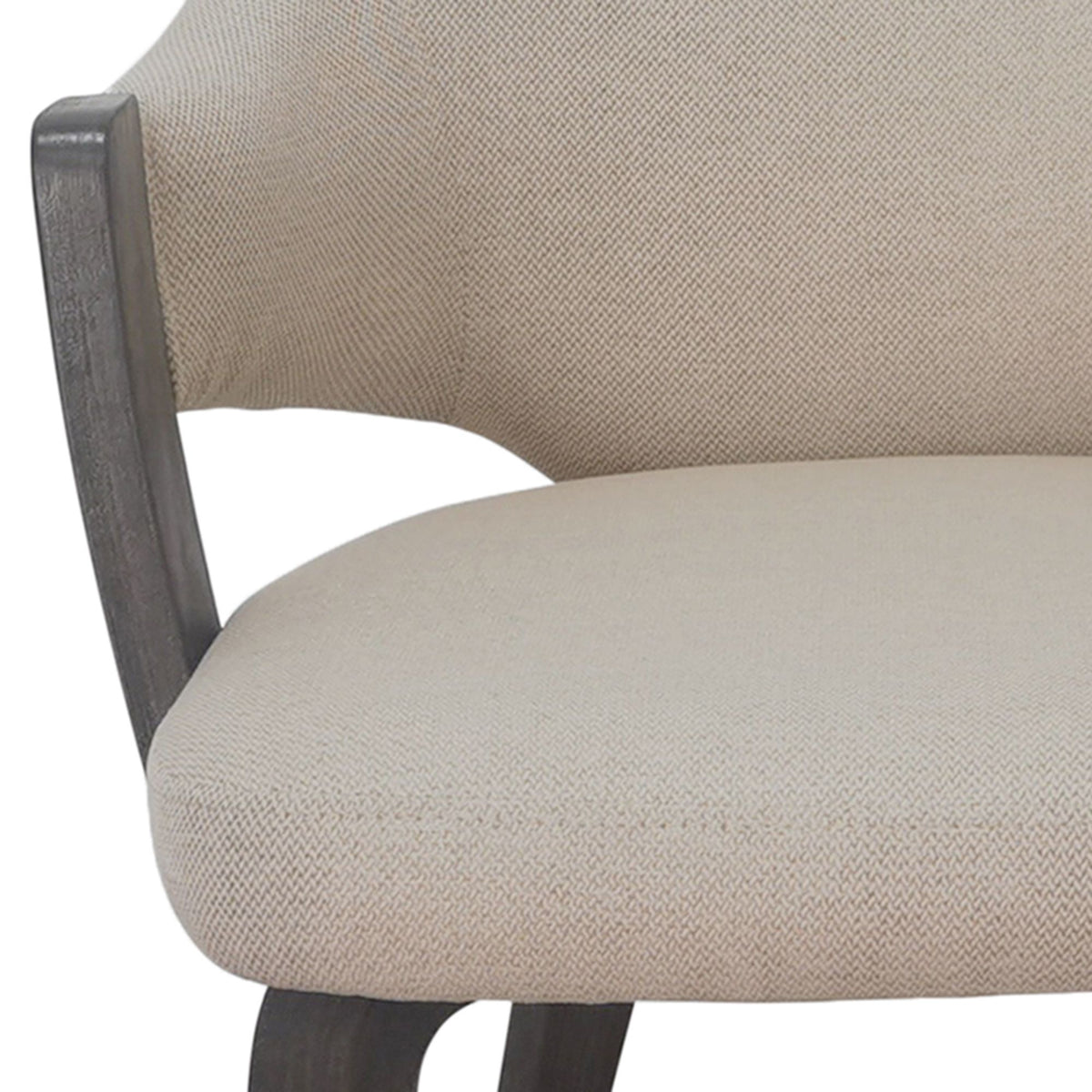 Close-up of a beige upholstered chair with a textured fabric finish featuring the Alden Dining Chair