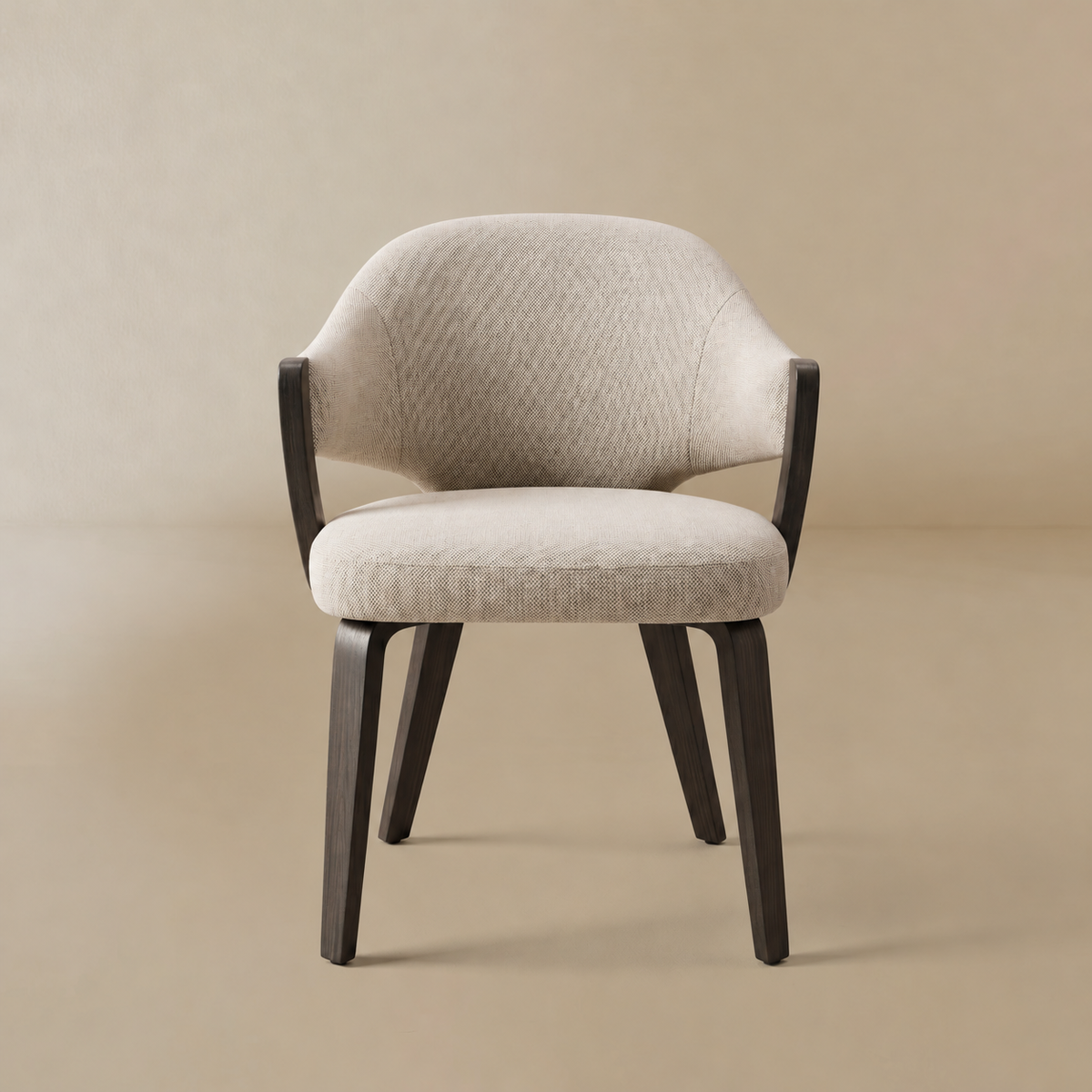 Alden dining chair with a textured light beige fabric upholstery and dark wood legs and armrests, set against a warm beige studio background.