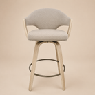 Gray cushioned bar stool with wooden legs on a beige background