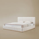 Angle view of the Alora Beige linen bed with ash wooden frame against a beige background