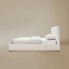 Side view of the Alora Beige linen bed with ash wooden frame against a beige background