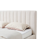 Beige tufted upholstered linen headboard on a white background