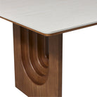 Close-up of the Arcadian Dining Table wooden table leg with a white travertine top
