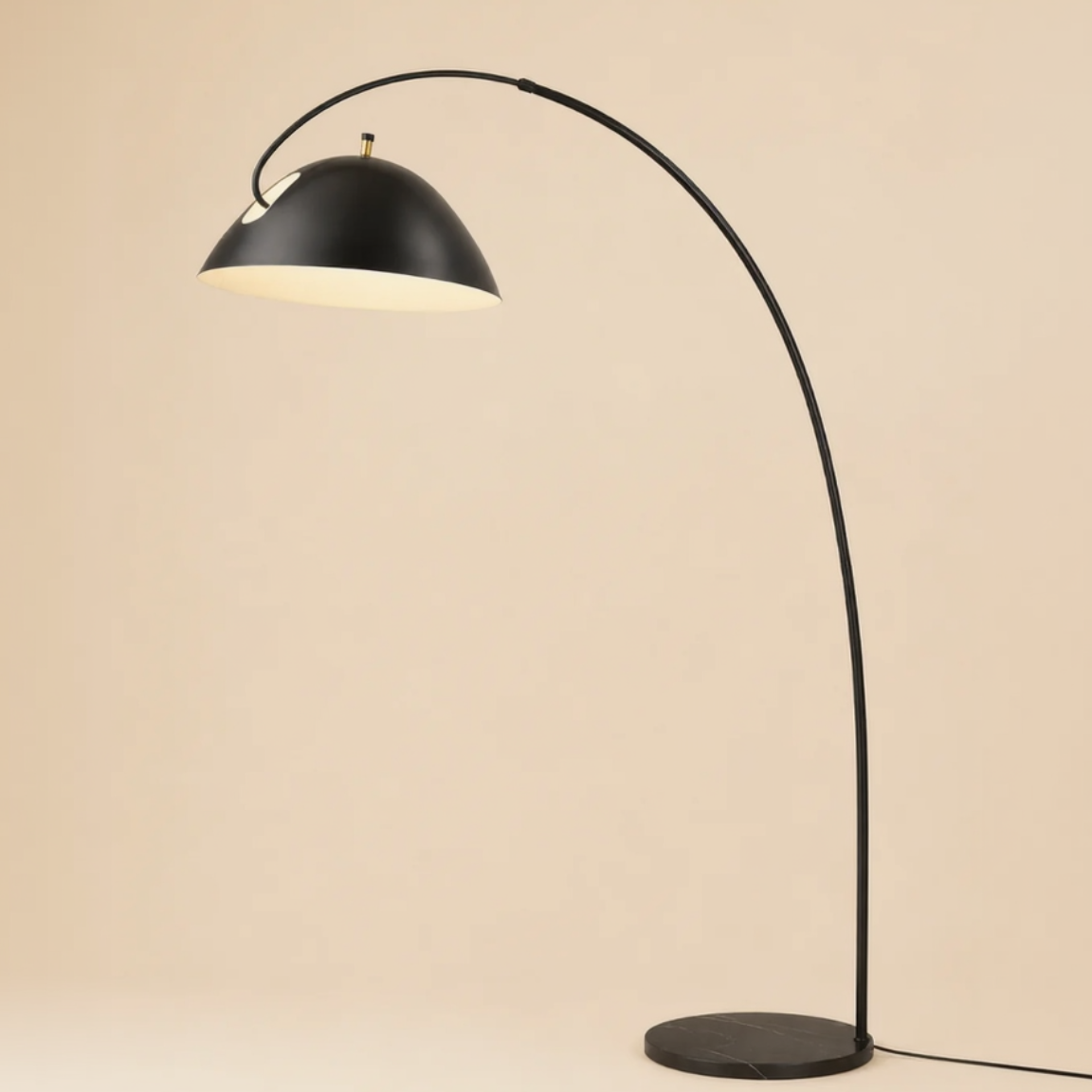 Black arch floor lamp on a beige background