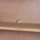 Interior detail of Arco cabinet showing shelf placement and rear cutout for cord management.