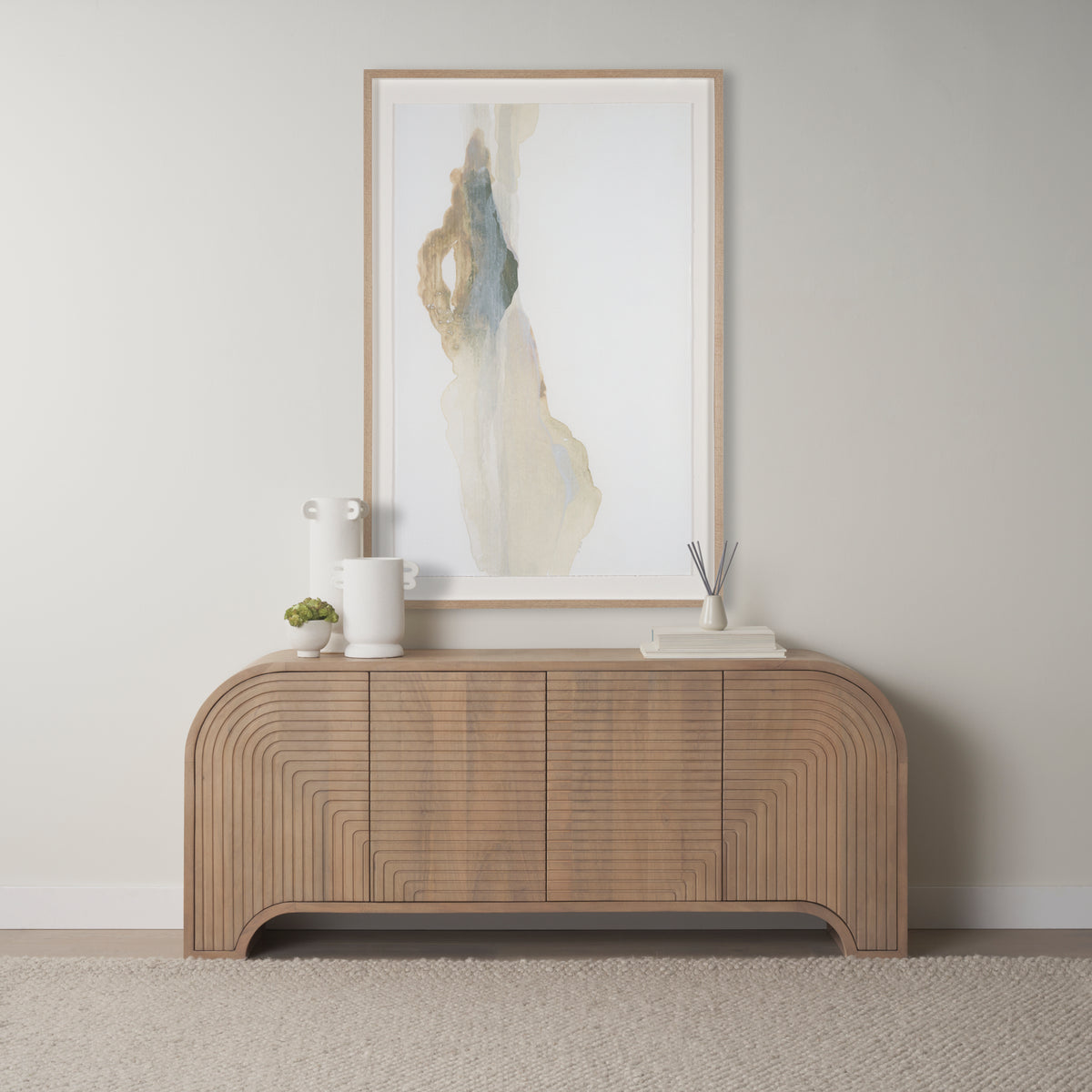 Arco fluted sideboard styled in a modern neutral living room beneath abstract wall art