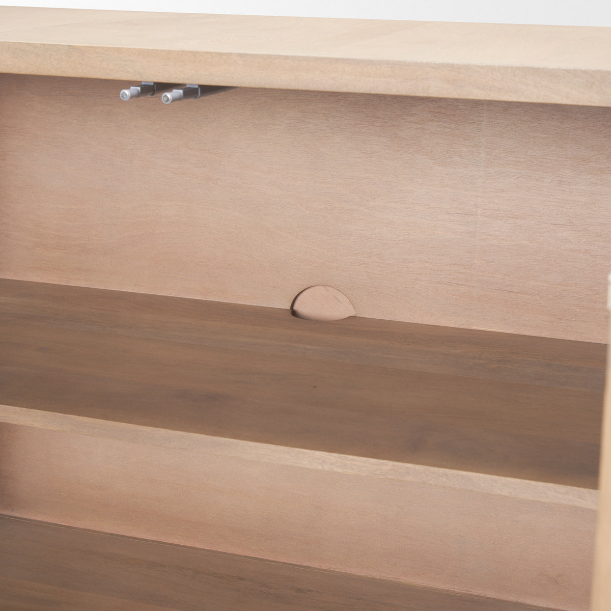 Interior detail of Arco sideboard showing shelf placement and rear cutout for cable management cords