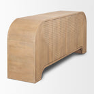 Angled view of Arco mango wood sideboard showing the rounded waterfall edge design and geometric fluting.