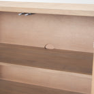 Interior detail of Arco sideboard showing shelf placement and rear cutout for cable management cords.
